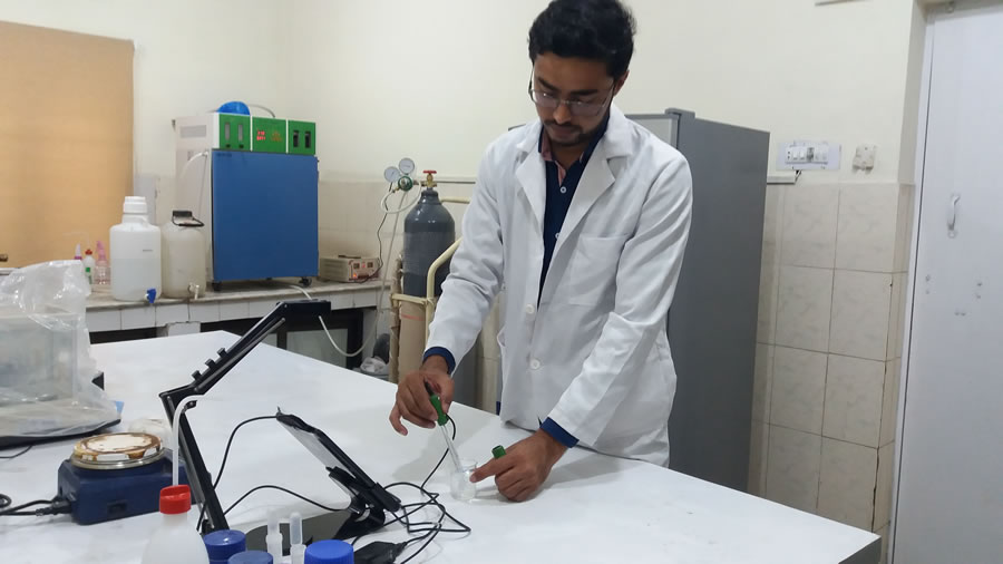 student performing practical in microbiology lab